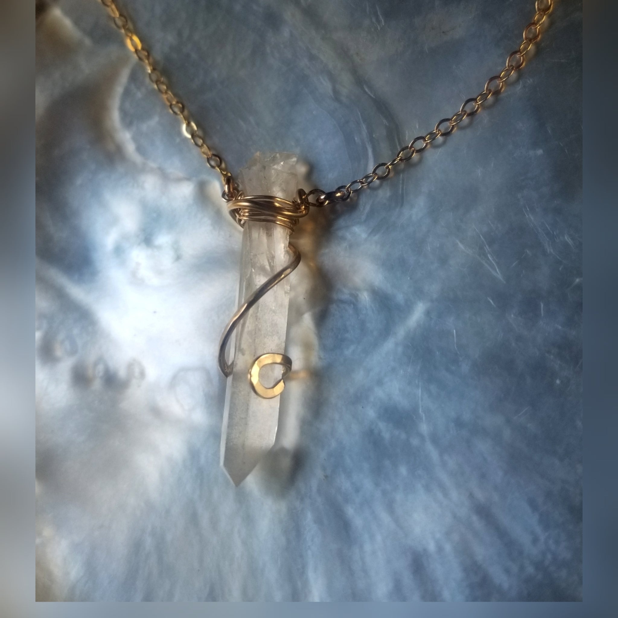 Swirl wrapped crystal necklace